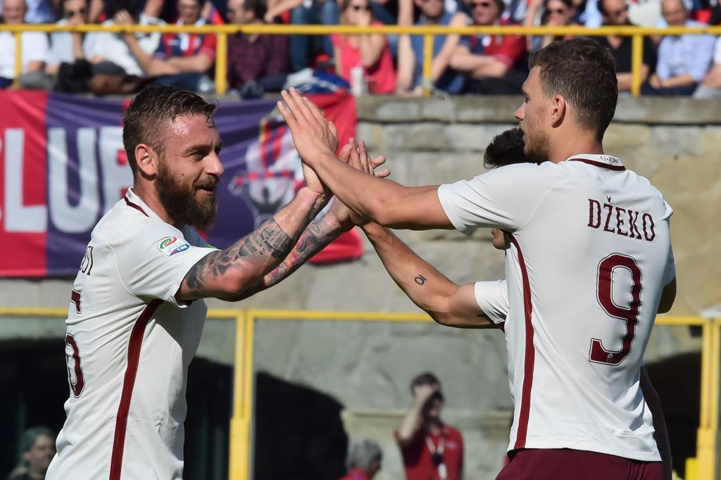 Roma vence Bologna e mantém diferença para líder Juventus