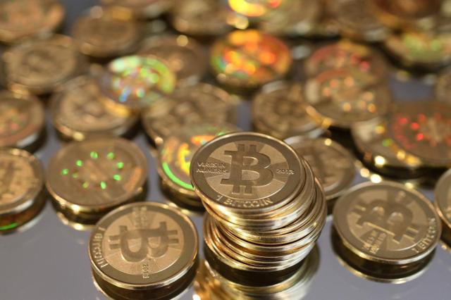 Entenda o bitcoin, moeda virtual pedida como resgate no megaciberataque George Frey,AFP/AFP
